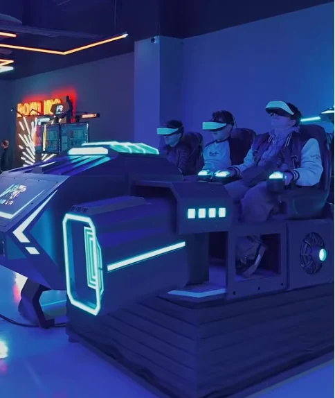 Three visitors using a multi-seat VR attraction at the Duhok entertainment center